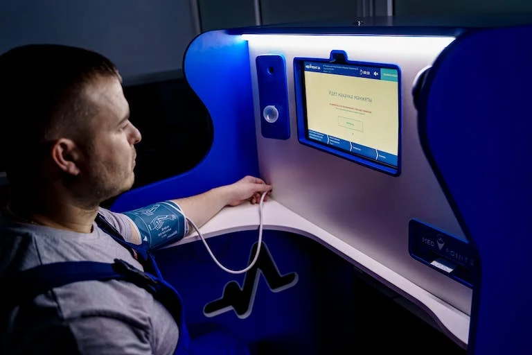 A Man Measuring His Blood Pressure Digitally