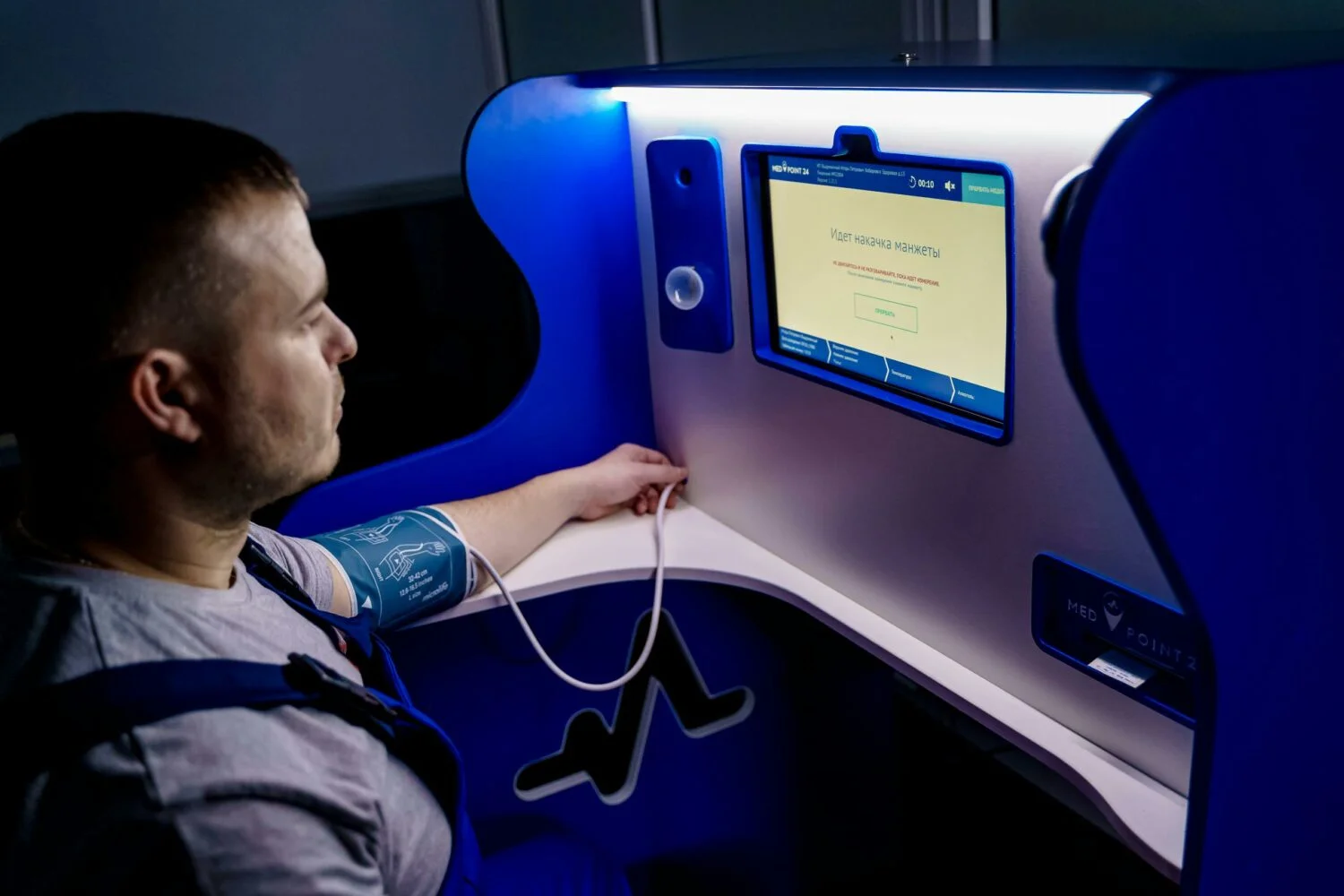 A Man Measuring His Blood Pressure Digitally